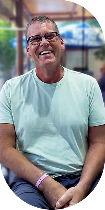 mature male patient at cancun dental design smiling after undergoing bone graft surgery