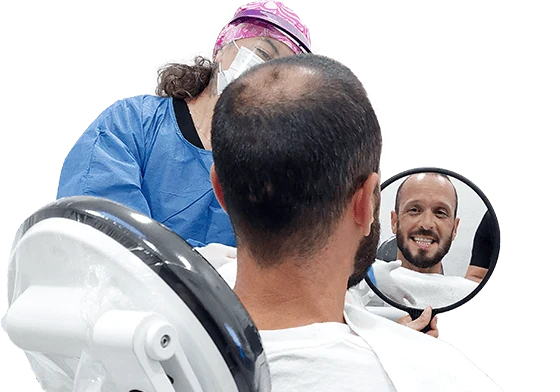 dentist in cancun dental design showing a patient his denture after getting an immediate load with zygomatic dental implants