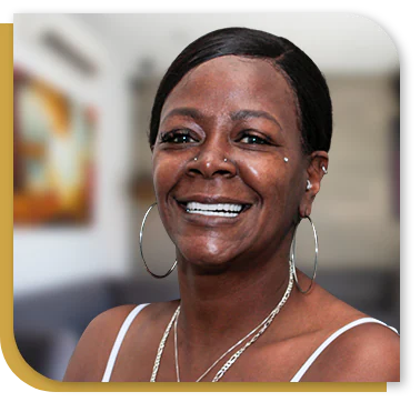 black woman patient at cancun dental design, smiling after her dental implant and bone graft treatments