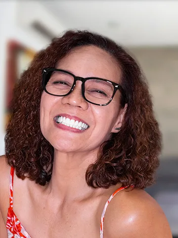 woman patient at cancun dental design showing her smile after getting all on 4 dental implants