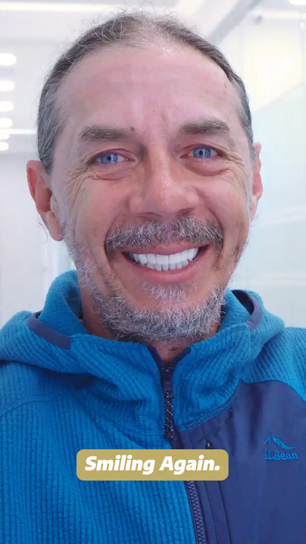 smiling for his dental work in cancun