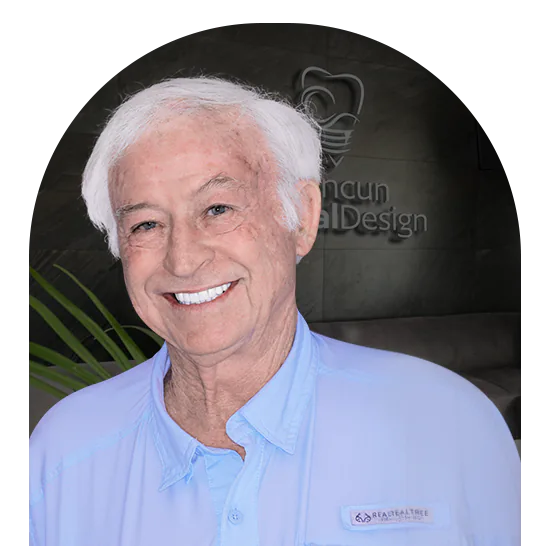 elder patient at Cancun Dental Design smiling after his root canal treatment