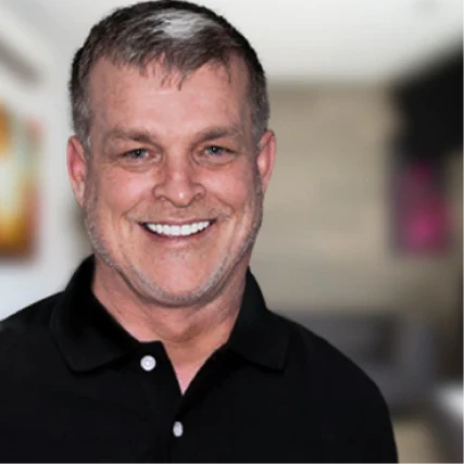 middle age man showcasing natural smile results after dental implants 