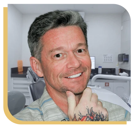 after treatment shoot of a man with a restored and bright denture