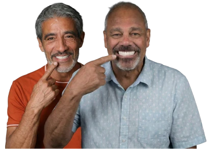 adult patients showcasing a beautiful smile after a restoration with dental implants