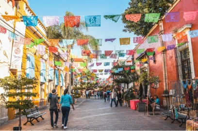 Colorful papel picado decorating the streets of Guadalajara, a vibrant destination known for combining rich culture with expert dental implant specialists.
