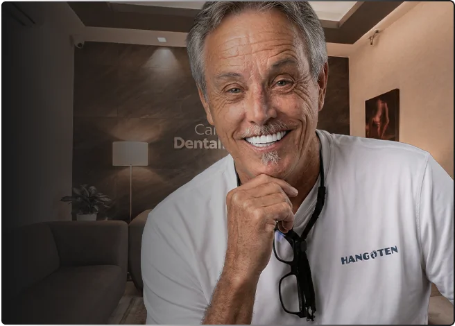 Happy senior patient showing All-on-4 dental implant results