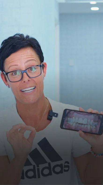 Female patient showing successful dental implant smile transformation