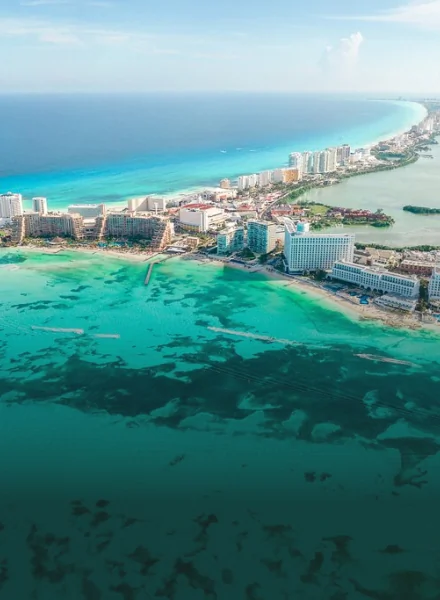 Aerial view of the Cancun beach landscape for a relaxing dental vacation experience in Mexico.